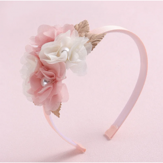 Serre tête rose pastel à...